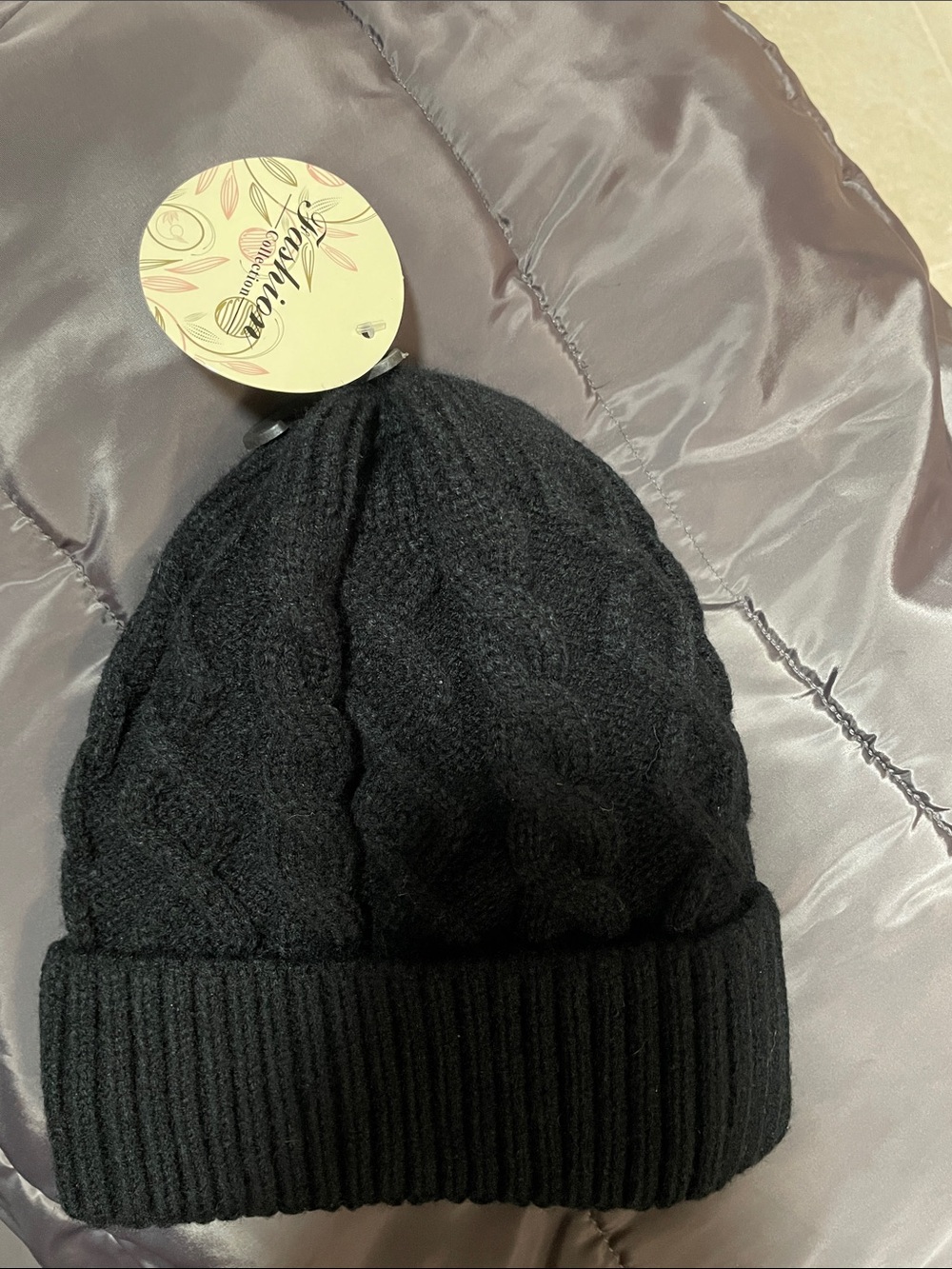 NWT Fashion Collection Black Knit Cable Beanie with a faux fur lining for warmth